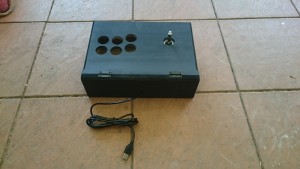 Spray painted box with Joystick mounted and USB cable attached